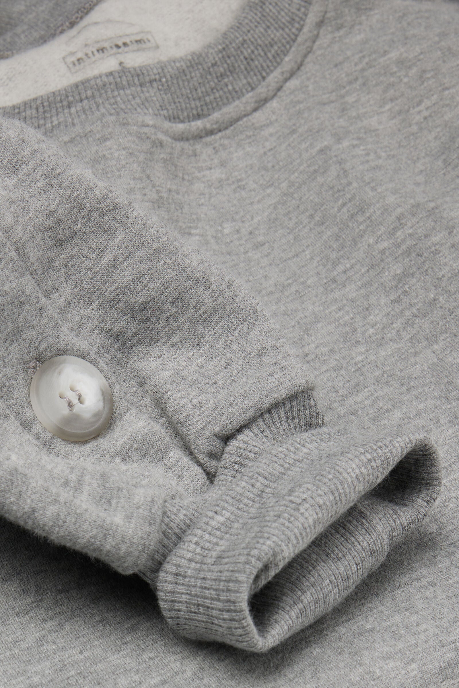 סווטשירט Coraline עם כפתורים בשרוולים